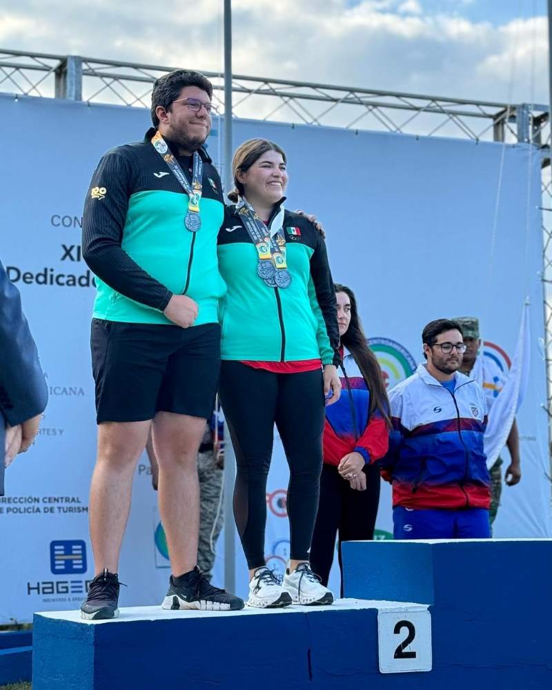 Mexico's shooting team proudly displays their silver medals after a fierce competition.