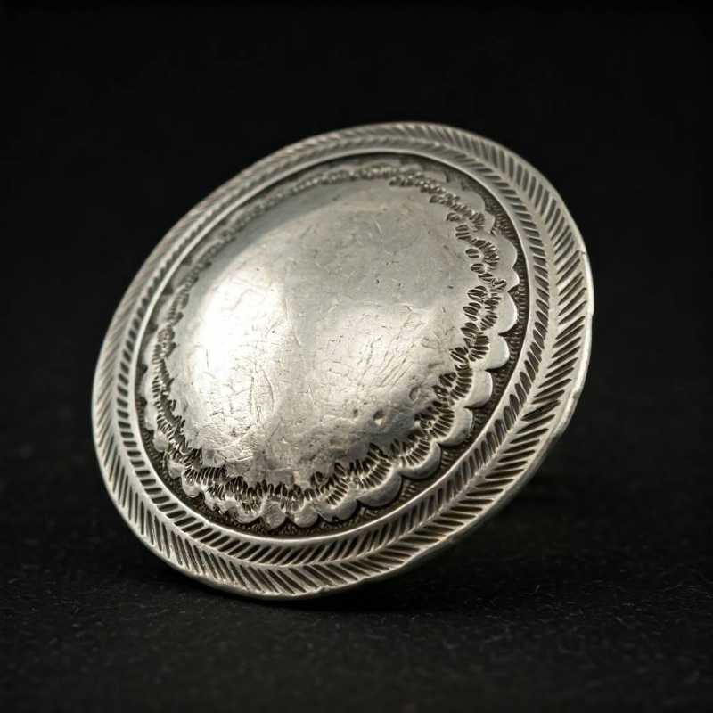 A close-up of intricately carved Taxco silver, highlighting its craftsmanship and potential value.