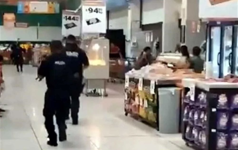 Watch: Armed Men Barricade Themselves in Supermarket After Shooting Children