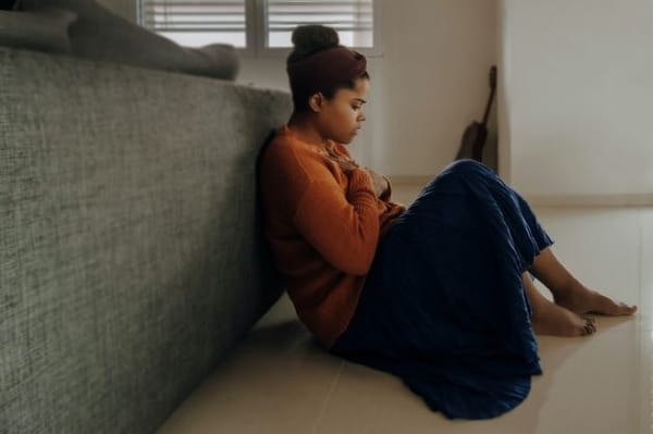 A young woman is seen suffering from anxiety in home environment.