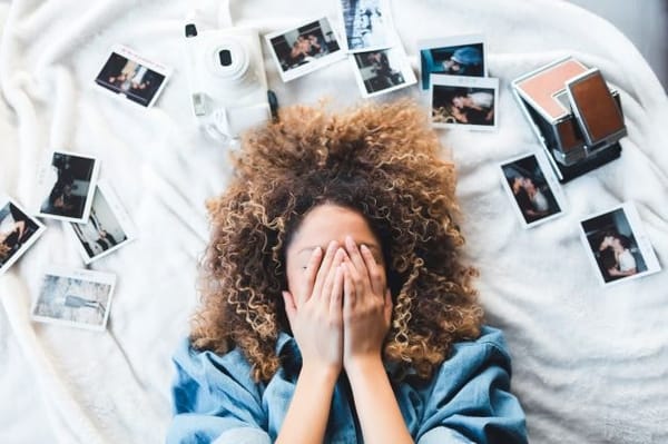 A young woman showing signs of impact from remembering the past.