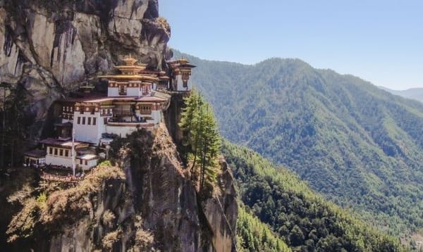 Visiting the distant kingdom of Bhutan perched atop the imposing Himalayas.