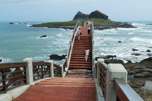 People can be seen crossing a bridge in Taiwan.