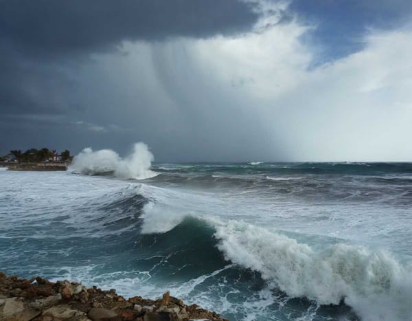 Twin cyclones threaten Mexico's coasts, a stormy spectacle of nature's unpredictability.