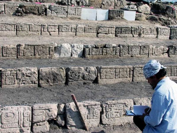 Archaeologist Octavio Esparza Olguín examines inscriptions, unveiling the secrets of Ocomtún's ancient past.