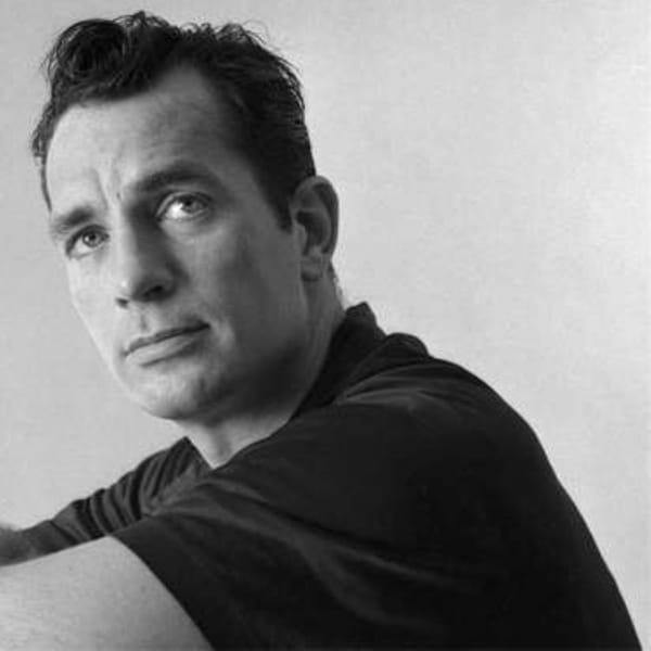 lack and white portrait of Jack Kerouac, writer, with a thoughtful expression.