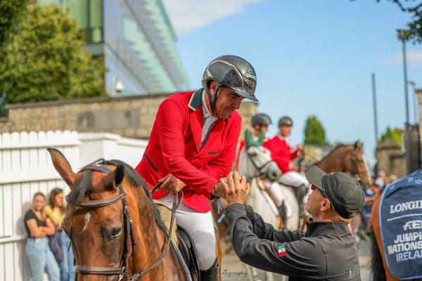 Nicolás Pizarro Martínez, dressed in equestrian attire, sits atop a majestic horse, showcasing his dedication and passion.