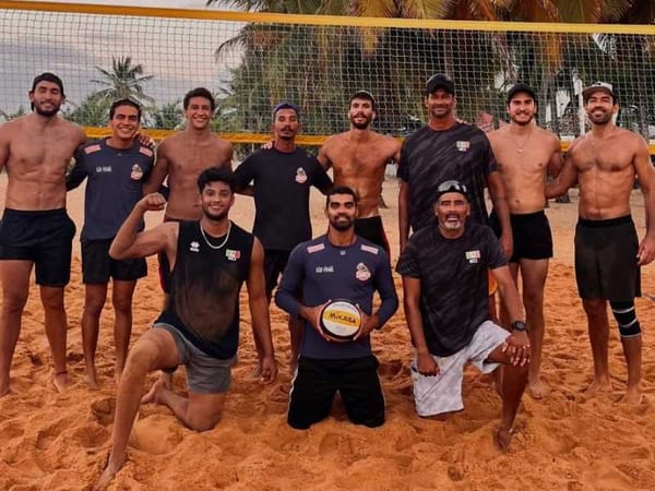 Mexican beach volleyball team practices on a sandy beach in Brazil with a net and palm trees.