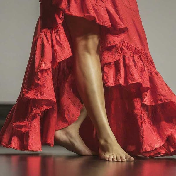 A group of people dancing the Jarabe Gatuno, a traditional Mexican dance.