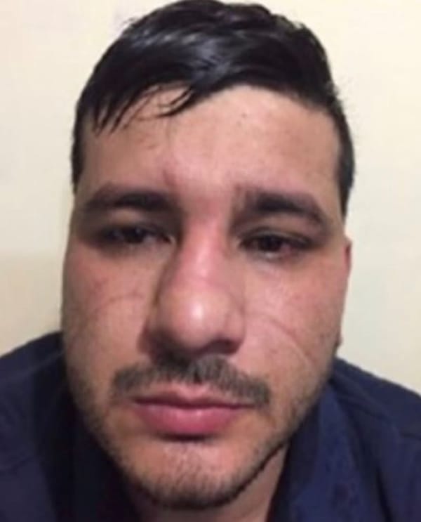 A portrait of Jorge Humberto Figueroa Benítez, a wanted criminal known as 'El Perris.'