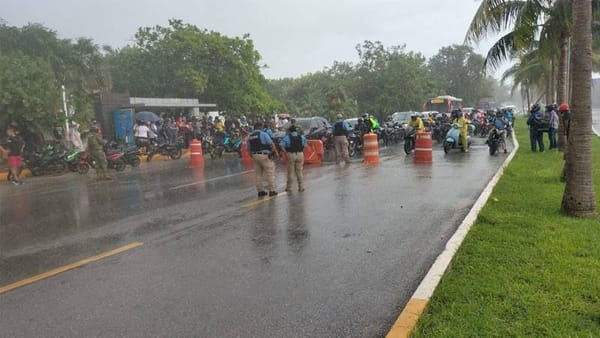 A photo of a long line of cars stuck in traffic on Kukulcan Boulevard in Cancun's hotel zone.