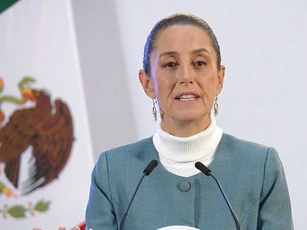 President Claudia Sheinbaum speaking at a podium during the morning press conference.