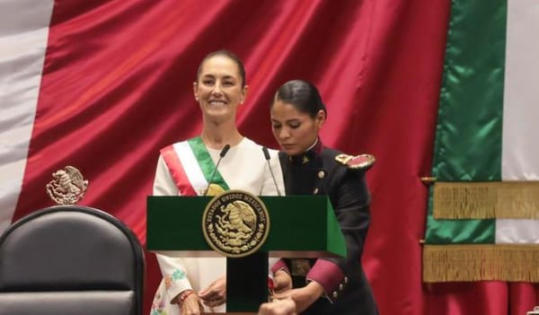 Claudia Sheinbaum being sworn in as Mexico’s first female president, symbolizing a new era of leadership.