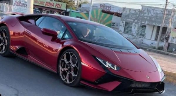 A Mexican politician driving a Lamborghini on a sunny day.