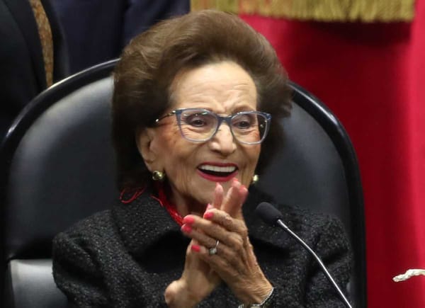 Elderly stateswoman Ifigenia Martínez, wearing formal attire.