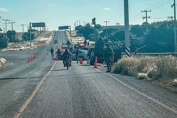 Police officers are seen investigating a crime scene in Jalisco, Mexico.