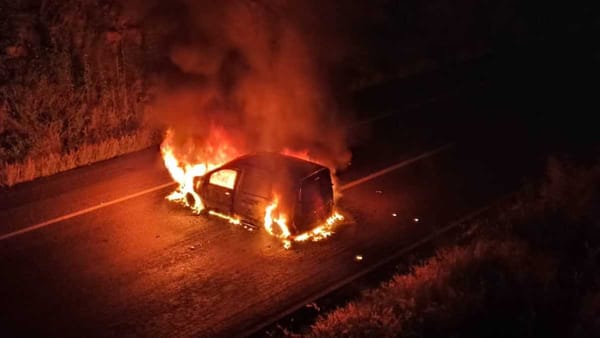 Burned vehicles and shattered glass mark the scene of a violent protest in Michoacán.