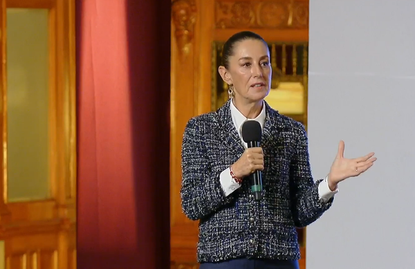 Claudia Sheinbaum speaking passionately at a podium during the People's Morning Conference.