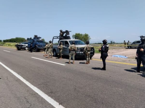 A group of armed soldiers patrolling the streets of Culiacán.