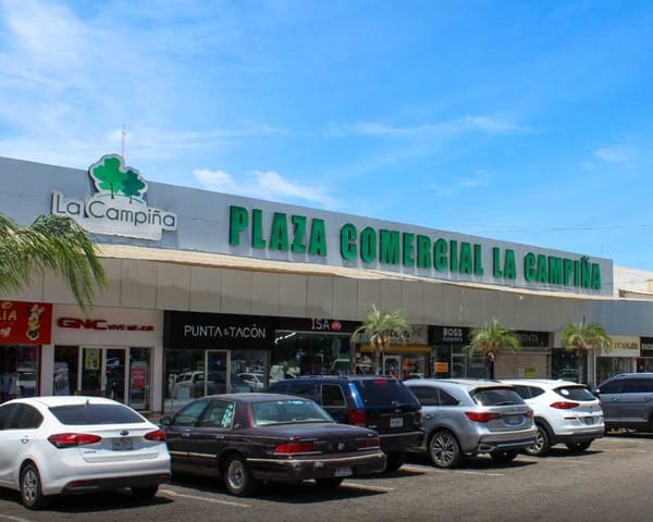 Police officers examine security camera footage from a Culiacán shopping center.