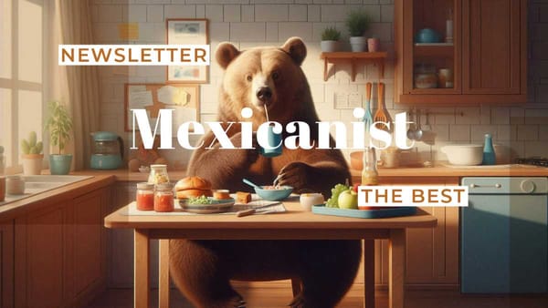 A bear sitting at a kitchen table, eating food.