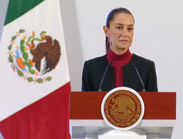 President Claudia Sheinbaum standing at presidential podium during Morning Conference.