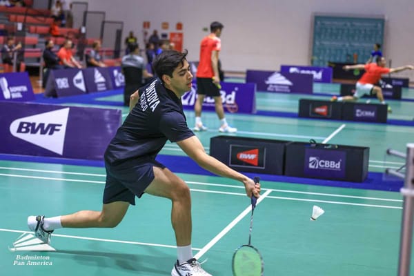 Mexican badminton player Luis Armando Montoya mid-jump, executing a powerful smash shot.