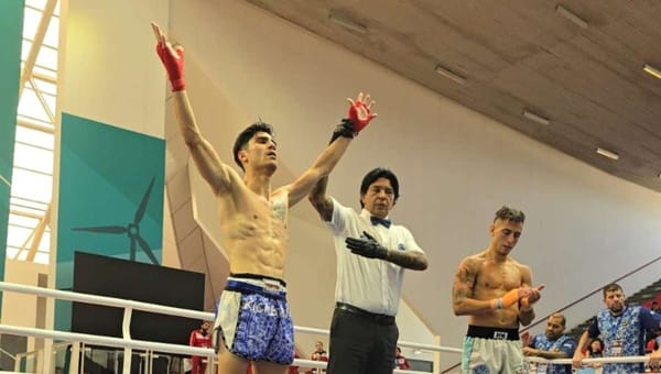 Raúl Campuzano celebrates after securing gold and a World Games spot at the Pan American Kickboxing.